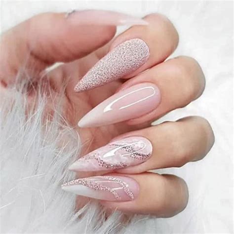 white stiletto nails with rhinestones|stiletto shaped nails.